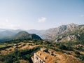 Bride and groom stand on the top of the Gorazda fort on Mount Lovcen. Drone