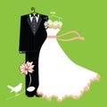 Bride and groom suit and gown on hangers