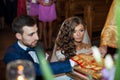 Bride and groom taking vows in church on old golden bible Royalty Free Stock Photo