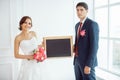Bride and groom in very bright room Royalty Free Stock Photo