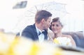 Bride and groom in a vintage car