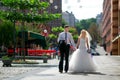 Bride and groom walk around the city Royalty Free Stock Photo