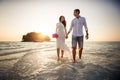 Bride and groom walk barefoot at spit Royalty Free Stock Photo