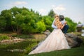 The bride and groom on a walk in the summer. Newlyweds in the park. Summer wedding in nature, Ukraine, Dnipro Royalty Free Stock Photo