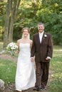 Bride and Groom Walking Along a Path