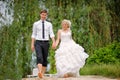 Bride and groom walking barefoot on the beach Royalty Free Stock Photo