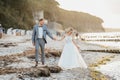 Bride and groom walking on the beach Royalty Free Stock Photo