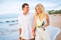 Bride and Groom Walking on Beautiful Tropical Beach at Sunset, R Royalty Free Stock Photo