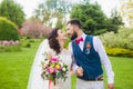 Bride and groom are walking on the lawn Royalty Free Stock Photo