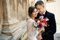 Bride and groom walking in old city Royalty Free Stock Photo