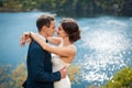 Bride and groom walking at the river Royalty Free Stock Photo