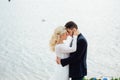 Bride and groom walking at the river Royalty Free Stock Photo