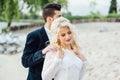 Bride and groom walking at the river Royalty Free Stock Photo