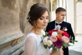 Bride and groom walking in old city Royalty Free Stock Photo