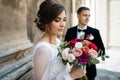 Bride and groom walking in old city Royalty Free Stock Photo