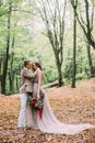 Bride and groom is walking on a trail in a beautiful romantic place on nature. Wedding ceremony outdoors. Royalty Free Stock Photo