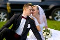 Bride and groom on wedding car background Royalty Free Stock Photo