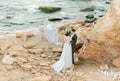 Bride and groom at wedding ceremony near sea Royalty Free Stock Photo