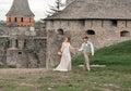 Bride and groom at wedding ceremony by the old castle Royalty Free Stock Photo