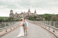 Bride and groom at wedding ceremony by the old castle Royalty Free Stock Photo