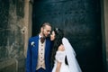 Bride and groom at wedding Day embracing with love. Happy romantic young couple celebrating their marriage in church Royalty Free Stock Photo
