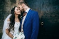 Bride and groom at wedding Day embracing with love. Happy romantic young couple celebrating their marriage in church Royalty Free Stock Photo