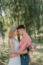 Bride and groom at wedding Day walking Outdoors on spring nature. Bridal couple, Happy Newlywed woman and man embracing Royalty Free Stock Photo