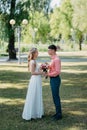 Bride and groom at wedding Day walking Outdoors on spring nature. Bridal couple, Happy Newlywed woman and man embracing Royalty Free Stock Photo