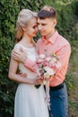 Bride and groom at wedding Day walking Outdoors on spring nature. Bridal couple, Happy Newlywed woman and man embracing Royalty Free Stock Photo