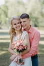 Bride and groom at wedding Day walking Outdoors on spring nature. Bridal couple, Happy Newlywed woman and man embracing Royalty Free Stock Photo