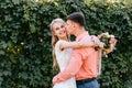 Bride and groom at wedding Day walking Outdoors on spring nature. Bridal couple, Happy Newlywed woman and man embracing Royalty Free Stock Photo