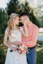 Bride and groom at wedding Day walking Outdoors on spring nature. Bridal couple, Happy Newlywed woman and man embracing Royalty Free Stock Photo