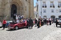 Bride, groom and wedding guests in front of the church Se Velha