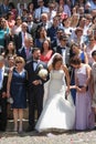 Bride, groom and wedding guests in front of the church Se Velha