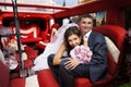 Bride and groom in wedding limousine Royalty Free Stock Photo