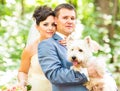 Bride and groom wedding with lovely white dog summer outdoor Royalty Free Stock Photo