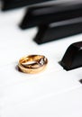 A pair of wedding rings on the piano