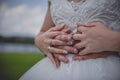 Bride and groom with wedding rings, close up. Young married couple holding hands on their wedding day. Royalty Free Stock Photo