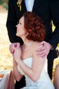 Bride and groom at the wedding table. Autumn outdoor setting. Royalty Free Stock Photo