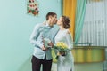 Bride and groom in a white dress kissing