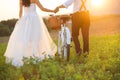 Bride and groom with a white wedding bike