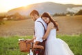 Bride and groom with a white wedding bike