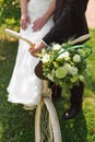 Bride and groom with a white wedding bike