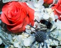 Bride and grooms wedding ring displayed in flowers