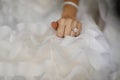 Bride hand with beautiful diamond ring on wedding dress Royalty Free Stock Photo