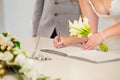 Bride hand with a pen signing wedding license. Marriage contract Royalty Free Stock Photo