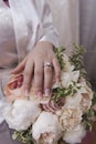 Bride hand with ring and nice flowers