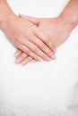Bride hand on wedding dress with a nice manicure Royalty Free Stock Photo