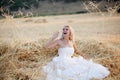 Bride in hay stack Royalty Free Stock Photo