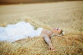 Bride in hay stack Royalty Free Stock Photo